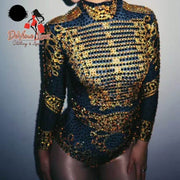 Devine Lux Custom Made Bodysuit Women Sexy Black Gold Rhinestone PaintIndulge in the allure of Devine Lux's Custom Made Bodysuit, where elegance meets extravagance. This exquisite piece is a symphony of black fabric adorned with shimmeHomeDeVine Lux Clothing & ApparelDevine Lux Custom Made Bodysuit Women Sexy Black Gold Rhinestone Paint Long Sleeve